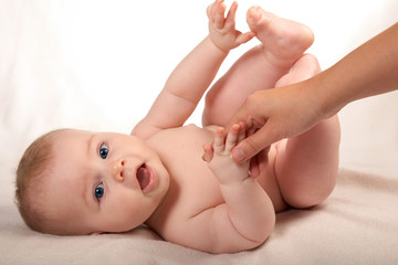 baby and his mother's hand