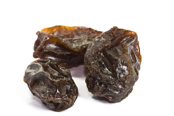 Raisins on white background