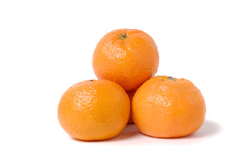 Four tangerines on a white