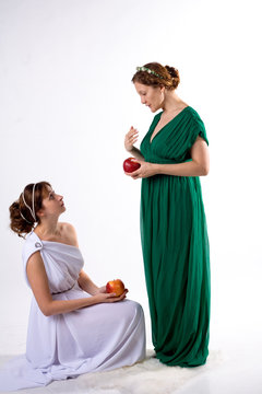 Two ladies and two apples