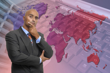 Businessman with a map and laptop as background