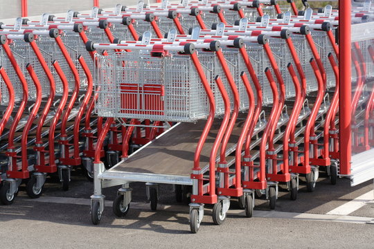 Many shopping carts going to the side out of focus
