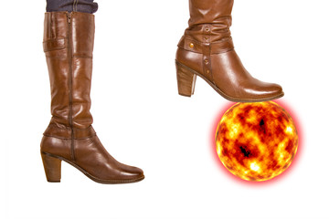 Brown woman's boot smash the sun