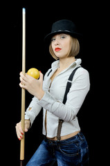 Young beautiful girl in hat with billiard cue and a ball