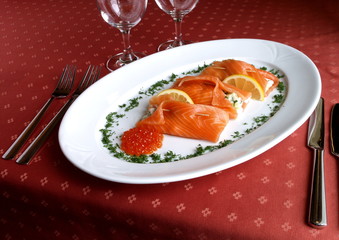 Dish of Italian cuisine - salmon packets with caviar