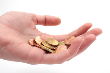 Hand mit Kleingeld