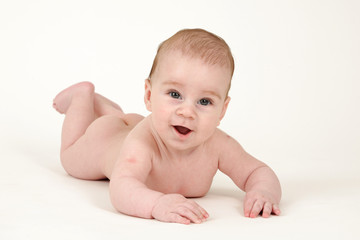 Small kid lying on white background