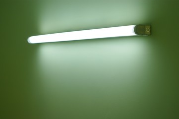 Wall lamp on the green wall