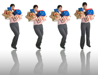 Obraz premium girls with armful of presents isolated over white + reflection