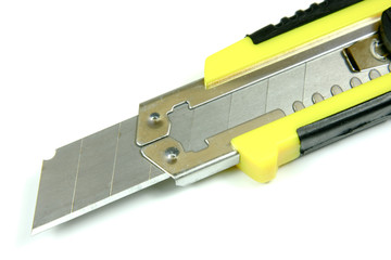 Office knife closeup, isolated on white