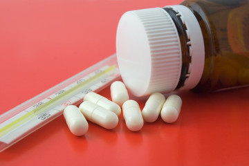 Pills and thermometer