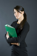 attractive young businesswoman holding a folder
