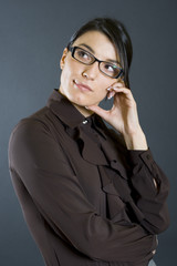 portrait of a young woman with glasses dissaproving