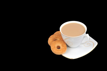 Cup of coffee with some cookies isolated on black