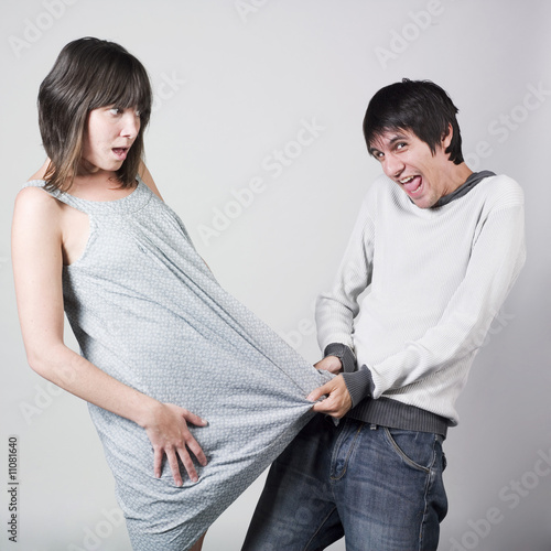 "crazy man pulling a woman's dress" Stock photo and royaltyfree images