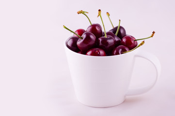 Red fresh cherries in the bowl