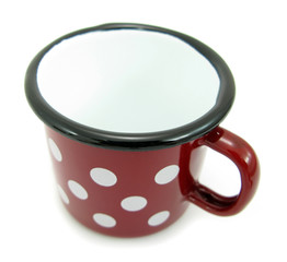 Old red pot with white spots