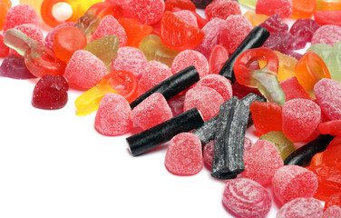 colored candies over white background