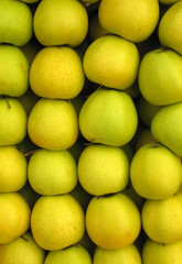 Yellow apples in market crate