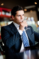 Businessman In Bar