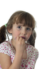 Little girl applying lip gloss