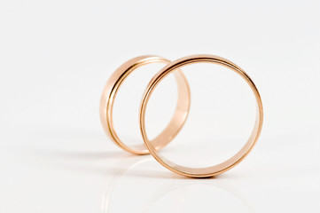 Two wedding rings isolated on a white