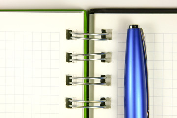 Notebook and a pen closeup photo