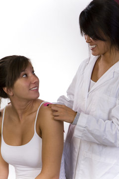 physical therapist talks with a patient