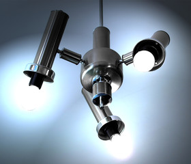 Lit chandelier with 3 lamps, white and blue tones