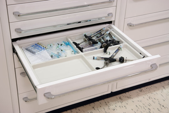 Dentist tools in open drawer