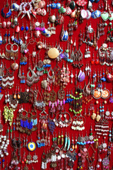 lots of earrings as background