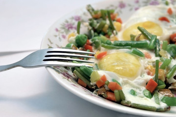 Dish with fried eggs on the light background