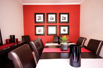 Dining room interior with red wall