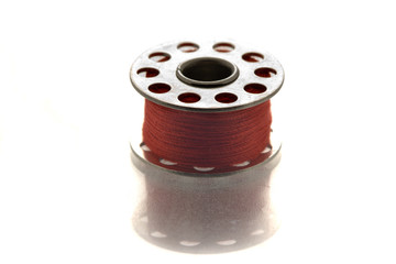 metallic spool of red thread