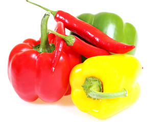 three peppers in three colors and red chili pepper