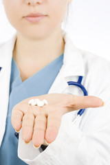pills in the hand of a doctor