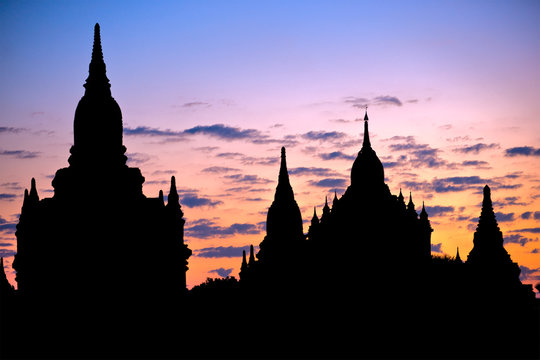 Silhouette of Buddhist Pagodas at sunrise, Bagan, Myanmar..