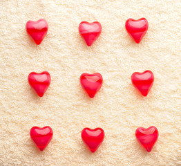 Fototapeta premium array of red nine hearts on towel