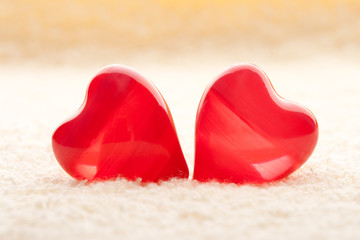 macro two red hearts on towel