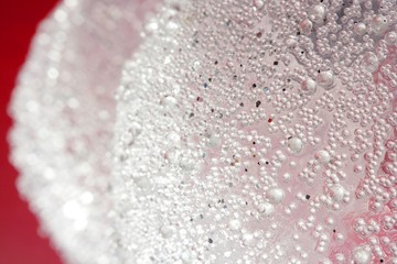 Balls over red background, transparent white spheres