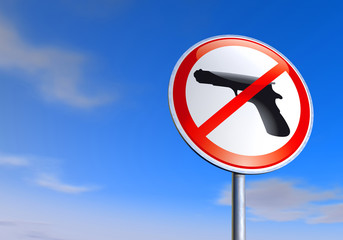 No guns sign against the blue sky