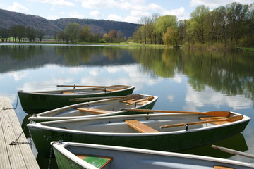 Pleasure boats in front of scenic landscape