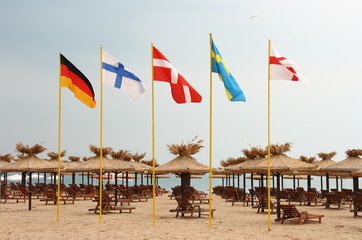 Five flags on the beach