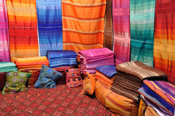 Colorful fabrics and cushions for sale in Fes, Morocco