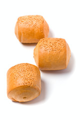 Three buns with sesame seeds