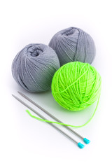 Three balls of wool and two knitting needles