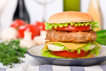 tall hamburger on a plate