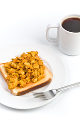 scrambled eggs on toast with large coffee