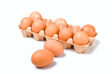 brown eggs in a cardboard container