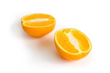 Photo of two halfs of orange isolated on white background